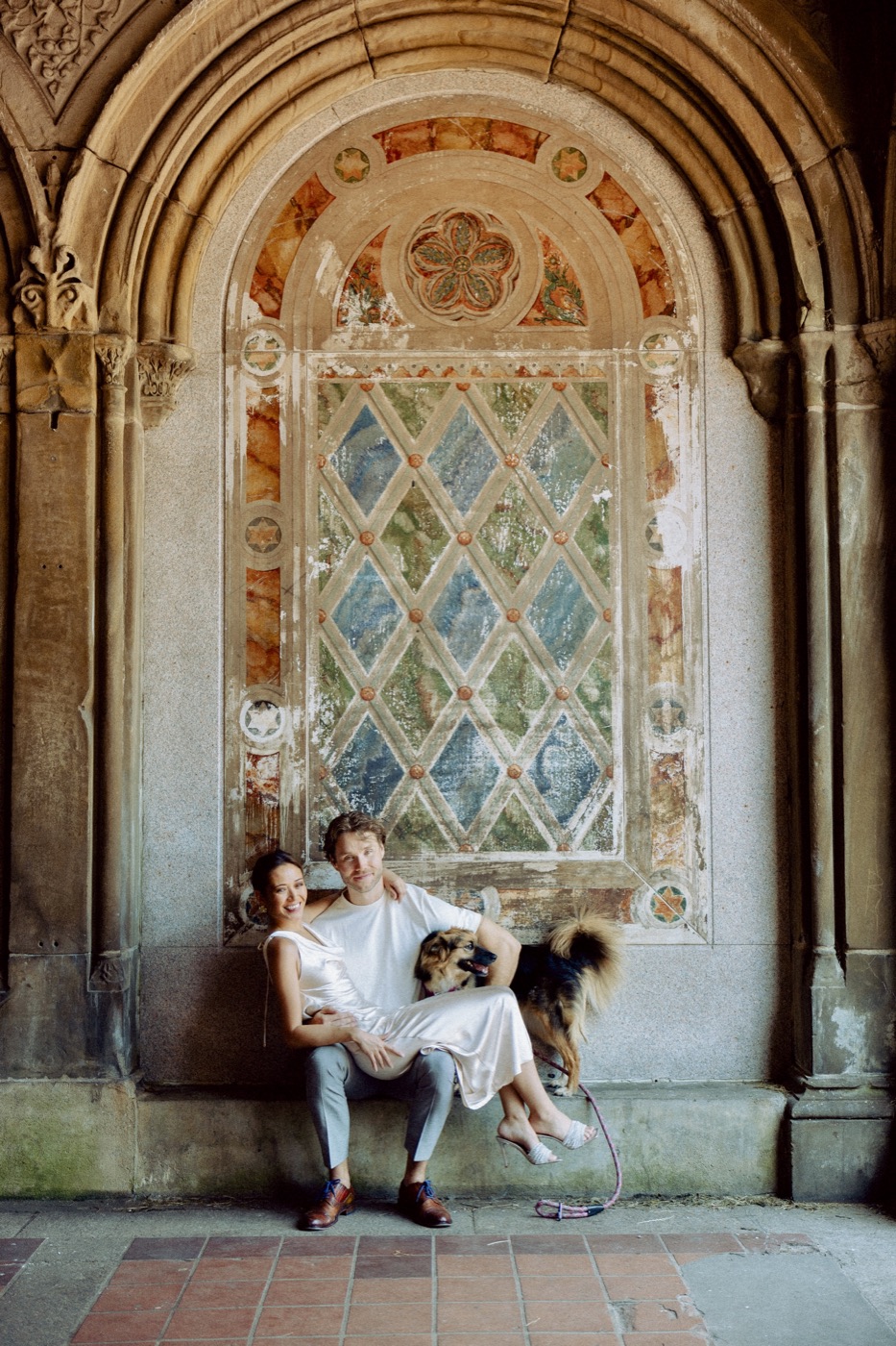 Kale and Mandy, founders of Sustainable Barks, with their rescue dog Piper at Bethesda Terrace in Central Park